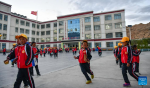 Pupils return to dormitory after night classes at a primary school of Zhaxizom Township in Tingri County, Xigaze City, southwest China`s Tibet Autonomous Region, June 5, 2023.