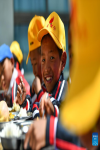 Pupils have lunch at the canteen of a primary school of Zhaxizom Township in Tingri County, Xigaze City, southwest China`s Tibet Autonomous Region, June 5, 2023.