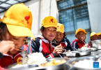 Pupils have lunch at a primary school of Zhaxizom Township in Tingri County, Xigaze City, southwest China`s Tibet Autonomous Region, June 5, 2023.