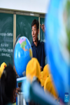 Danba Rinqen, vice president of a primary school of Zhaxizom Township, instructs students in a science class in Tingri County, Xigaze City, southwest China`s Tibet Autonomous Region, June 5, 2023.