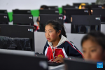 Pupils attend a computer class at a primary school of Zhaxizom Township in Tingri County, Xigaze City, southwest China`s Tibet Autonomous Region, June 5, 2023.