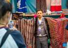 An exhibitor from India displays shawls during the 5th China Xizang Tourism and Culture Expo in Lhasa, southwest China`s Tibet Autonomous Region, June 17, 2023. The 5th China Xizang Tourism and Culture Expo opened here on Friday. The three-day expo is one of the most important events on Tibet`s cultural calendar. Nearly 1,000 businesses from home and abroad have attended the event, bringing about 10,000 different products. (Xinhua/Sun Fei)