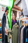 A staff member presents cashmere clothing during the 5th China Xizang Tourism and Culture Expo in Lhasa, southwest China`s Tibet Autonomous Region, June 17, 2023. The 5th China Xizang Tourism and Culture Expo opened here on Friday. The three-day expo is one of the most important events on Tibet`s cultural calendar. Nearly 1,000 businesses from home and abroad have attended the event, bringing about 10,000 different products. (Xinhua/Sun Fei)