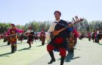 A large-scale folk dance performed by 1,000 dancers at the Shanghai Stadium in Shigatse city of the Tibet autonomous region on Sunday. [Photo provided to chinadaily.com.cn]