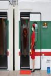 Attendants of Fuxing bullet train C891 on the Xining-Golmud section of the Qinghai-Tibet Railway wait for passengers in Xining, Northwest China`s Qinghai province, July 1, 2023. [Photo/Xinhua]