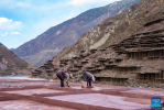 Villagers work at a salt field in Naxi Ethnic Township of Markam County in the city of Qamdo, southwest China`s Tibet Autonomous Region, Oct. 20, 2023. (Xinhua/Sun Fei)