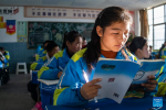 Sichod Drolma has a Tibetan language class at Damxung County Middle School in Damxung County, southwest China`s Xizang Autonomous Region, Nov. 10, 2023. (Xinhua/Sun Fei)