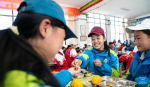 Sichod Drolma (C) has lunch at Damxung County Middle School in Damxung County, southwest China`s Xizang Autonomous Region, Nov. 10, 2023. (Photo by Tenzin Nyida/Xinhua)