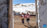 Sichod Drolma (R) and her sister play at home in Damxung County, southwest China`s Xizang Autonomous Region, Nov. 15, 2023. (Photo by Tenzin Nyida/Xinhua)