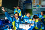 Sichod Drolma (3rd R) and her classmates are pictured during a class-break at Damxung County Middle School in Damxung County, southwest China`s Xizang Autonomous Region, Nov. 10, 2023. (Xinhua/Sun Fei)