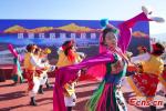 People dance at the ceremony marking the opening of the Lijiang-Shangri-la railway at the Shangri-la railway station in Shangri-la, southwest China`s Yunnan Province, Nov. 26, 2023. (Photo: China News Service/Liu Ranyang)