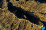 This aerial photo taken on July 15, 2023 shows a part of the Great Wall in Jiayuguan City, northwest China`s Gansu Province. Gansu Province is home to multiple sections of the Great Wall that add up to 3,654 kilometers in length. The Hexi Corridor, a critical part of the ancient Silk Road winding through south of the province, boasts more than 1,400 kilometers of the Wall built in the Han Dynasty (202 BC-220 AD), and over 1,200 kilometers erected in the Ming Dynasty (1368-1644). Gansu is therefore dubbed `an open-air museum of the Great Wall.` (Xinhua/Fang Xin)