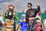 Models present traditional Tibetan costumes during the first Lhasa Fashion Week held at the Potala Palace square in Lhasa, southwest China`s Xizang Autonomous Region, Dec. 24, 2023. Models presented 60 traditional Tibetan costumes in the fashion show. (Photo/China News Service)
