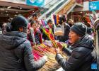 People shop for colored highland barley at a local market for the upcoming Chinese New Year in Lhasa, southwest China`s Xizang Autonomous Region, Feb. 6, 2024. (Xinhua/Sun Ruibo)