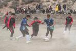 Players stage a soccer game in Mali village in Lhorong county in Chamdo city, Xizang autonomous region, on Jan 21 during the annual `New Year Cup` tournament. SUN FEI/XINHUA