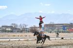 Riders perform in Lhasa, southwest China`s Xizang Autonomous Region, Feb. 12, 2024. (Xinhua/Sun Ruibo)