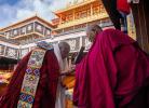 A monk (L) receives a certificate for the degree of Geshe Lharampa in the Jokhang Temple in Lhasa, capital of southwest China`s Xizang Autonomous Region, Feb. 28, 2024. (Xinhua/Tenzing Nima Qadhup)