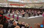 People watch a performance at a park to celebrate the Serfs` Emancipation Day in Lhasa, capital of southwest China`s Xizang Autonomous Region, March 28, 2024. On March 28, 1959, people in Xizang launched the democratic reform, freeing a million serfs. In 2009, the regional legislature announced March 28 as the day to commemorate the emancipation of the one million serfs. (Xinhua/Jigme Dorje)