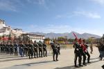 People from all walks of life of the Xizang autonomous region attend a flag-raising ceremony at the Potala Palace Square to mark the 65th anniversary of abolishing the region`s feudal serfdom, in Lhasa, capital of the region on Thursday. [Photo by Palden Nyima/For chinadaily.com.cn]