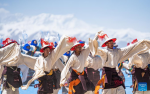 Performers dance at an event celebrating the melting of frozen water of Lake Namtso in southwest China`s Xizang Autonomous Region, May 19, 2024. As temperature rises and ice melts, the Lake Namtso will enter its tourism season. (Xinhua/Tenzin Nyida)