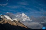 This photo taken on May 21, 2024 shows a view of Mount Qomolangma in southwest China`s Xizang Autonomous Region. The Mount Qomolangma National Park has entered peak tourism season. From Jan. 1 to May 20 this year, the Mount Qomolangma scenic spot has received about 136,000 tourists. (Xinhua/Sun Fei)