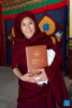 A Buddhist nun shows her diploma at the graduation ceremony at Tibet Buddhism University in Lhasa, southwest China`s Xizang Autonomous Region, June 30, 2024. A graduation ceremony was organized by the Tibet Buddhism University here on Sunday, awarding the `Chi Ram Pa` diploma (master`s degree) to 29 Buddhist nuns. (Xinhua/Tenzing Nima Qadhup)