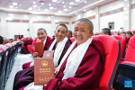 Buddhist nuns show their diplomas at the graduation ceremony at Tibet Buddhism University in Lhasa, southwest China`s Xizang Autonomous Region, June 30, 2024. A graduation ceremony was organized by the Tibet Buddhism University here on Sunday, awarding the `Chi Ram Pa` diploma (master`s degree) to 29 Buddhist nuns. (Xinhua/Tenzing Nima Qadhup)