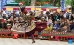 An artist stages a Tibetan opera performance at Norbulingka in Lhasa, southwest China`s Xizang Autonomous Region, Aug. 8, 2024. Tibetan opera performances are staged here from Aug. 4 to Aug. 10 in celebration of the traditional Shoton Festival, or Yogurt Festival. (Xinhua/Jigme Dorje)