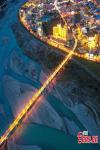 Lights illuminate Nyingchi City along the Nyang River, creating a picturesque night scenery in southwest China`s Xizang Autonomous Region, Aug. 22, 2024. (Photo/China News Service)