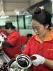 Employees work at Xizang Shangchu Cooking Utensils Technology to produce a series of multifunctional utensils. [Photo by Palden Nyima/chinadaily.com.cn]