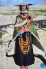 A villager displays folk costume in Kejia Village of Pulan County, southwest China`s Xizang Autonomous Region, Sept. 9, 2024.  Originating in Pulan County, Pulan folk costume has been a traditional garment worn at celebrations for over a millennium. Weighing more than 20 kilograms, a piece of this unique costume is usually decorated with rare metals and jewels, like gold, silver, beeswax, coral and turquoise. (Xinhua/Sun Ruibo)