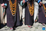 Villagers dressed in folk costume dance in Kejia Village of Pulan County, southwest China`s Xizang Autonomous Region, Sept. 9, 2024.  Originating in Pulan County, Pulan folk costume has been a traditional garment worn at celebrations for over a millennium. Weighing more than 20 kilograms, a piece of this unique costume is usually decorated with rare metals and jewels, like gold, silver, beeswax, coral and turquoise. (Xinhua/Sun Ruibo)