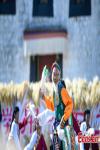 A performance is staged to celebrate the 7th Chinese Farmers` Harvest Festival in Shannan City, southwest China`s Xizang Autonomous Region, Sept. 22, 2024. (Photo/China News Service)